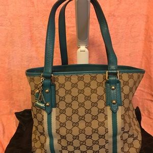 Used Gucci tan and teal Gucci purse